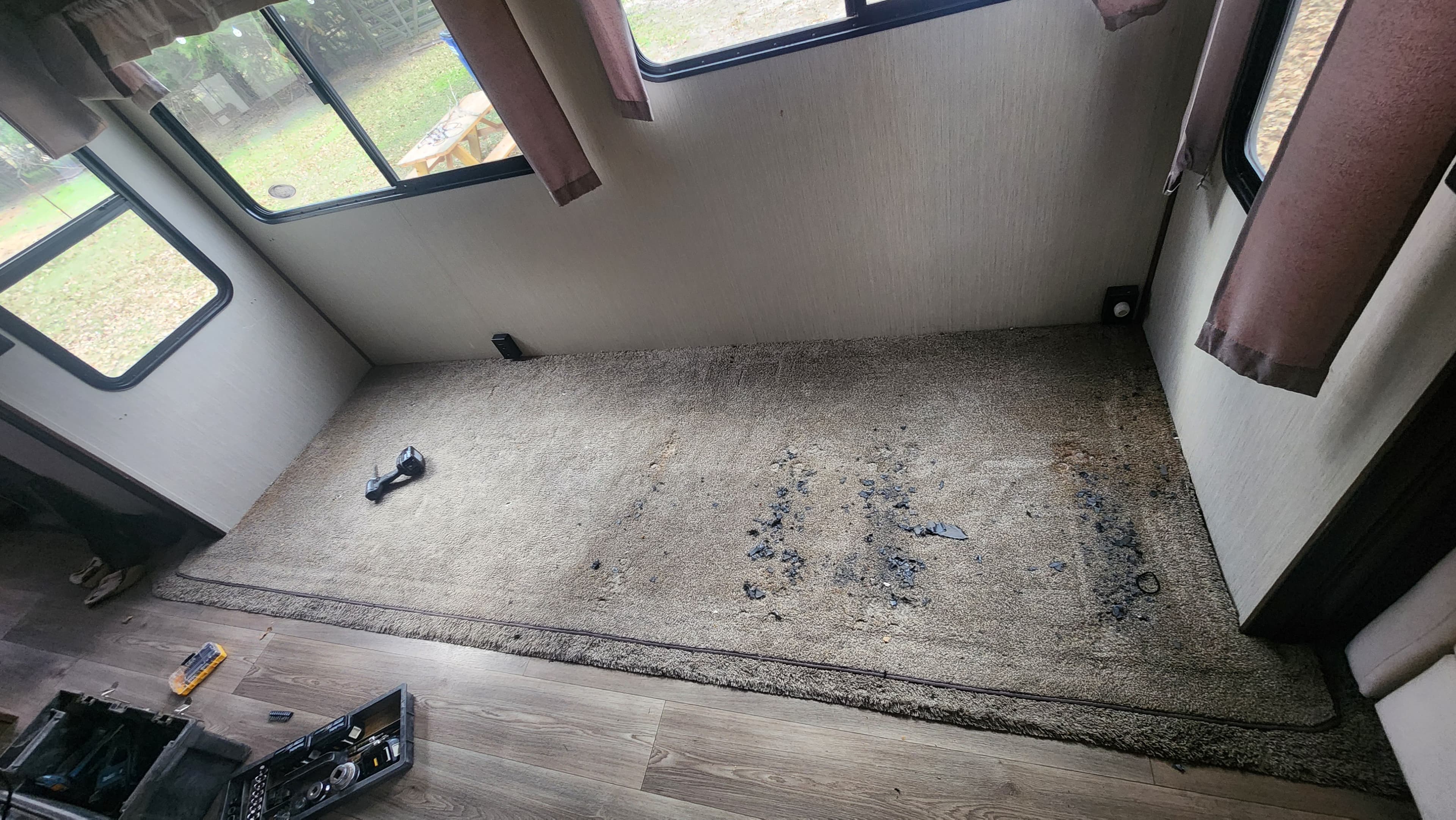 RV slide out with water-damaged flooring before repair — subfloor rot Montgomery County TX